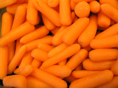 Baby peeled carrots in a bowl for a picnic