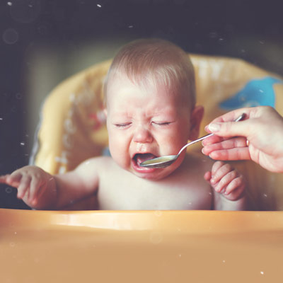 Toddler-crying-in-a-highchair