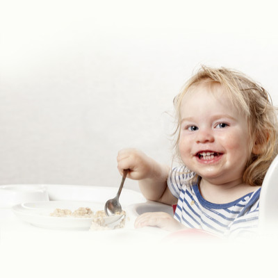 2-3-year-old-in-pajamas-eating-breakfast